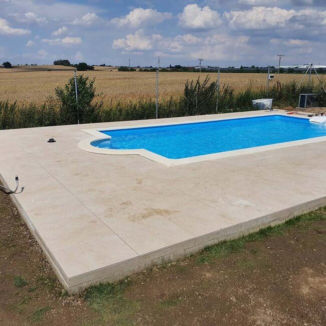 Finished pool with pavers around it laid on adjustable solver pedestals