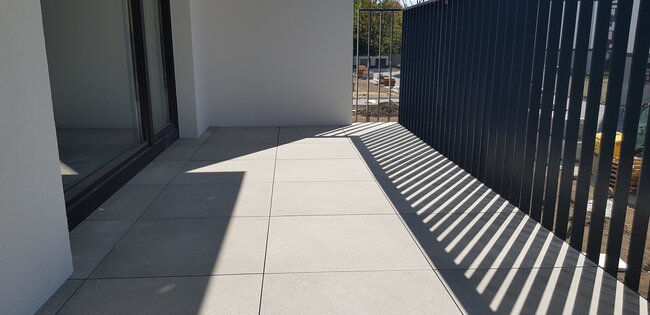 Porcelain tiles laid on a raised deck terrace