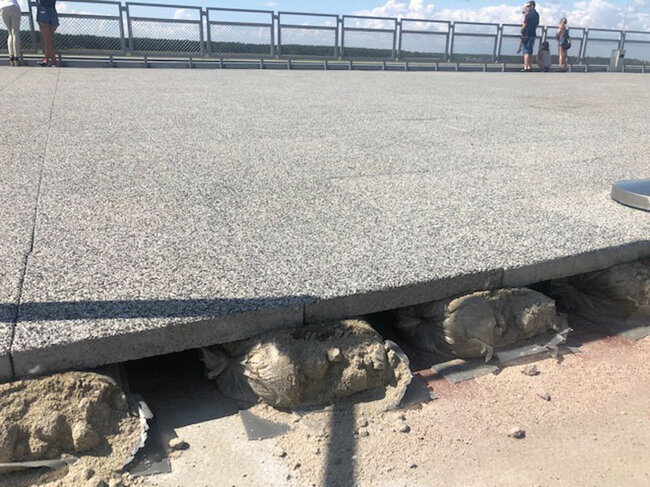 Granite elevated terrace supported on sandbags