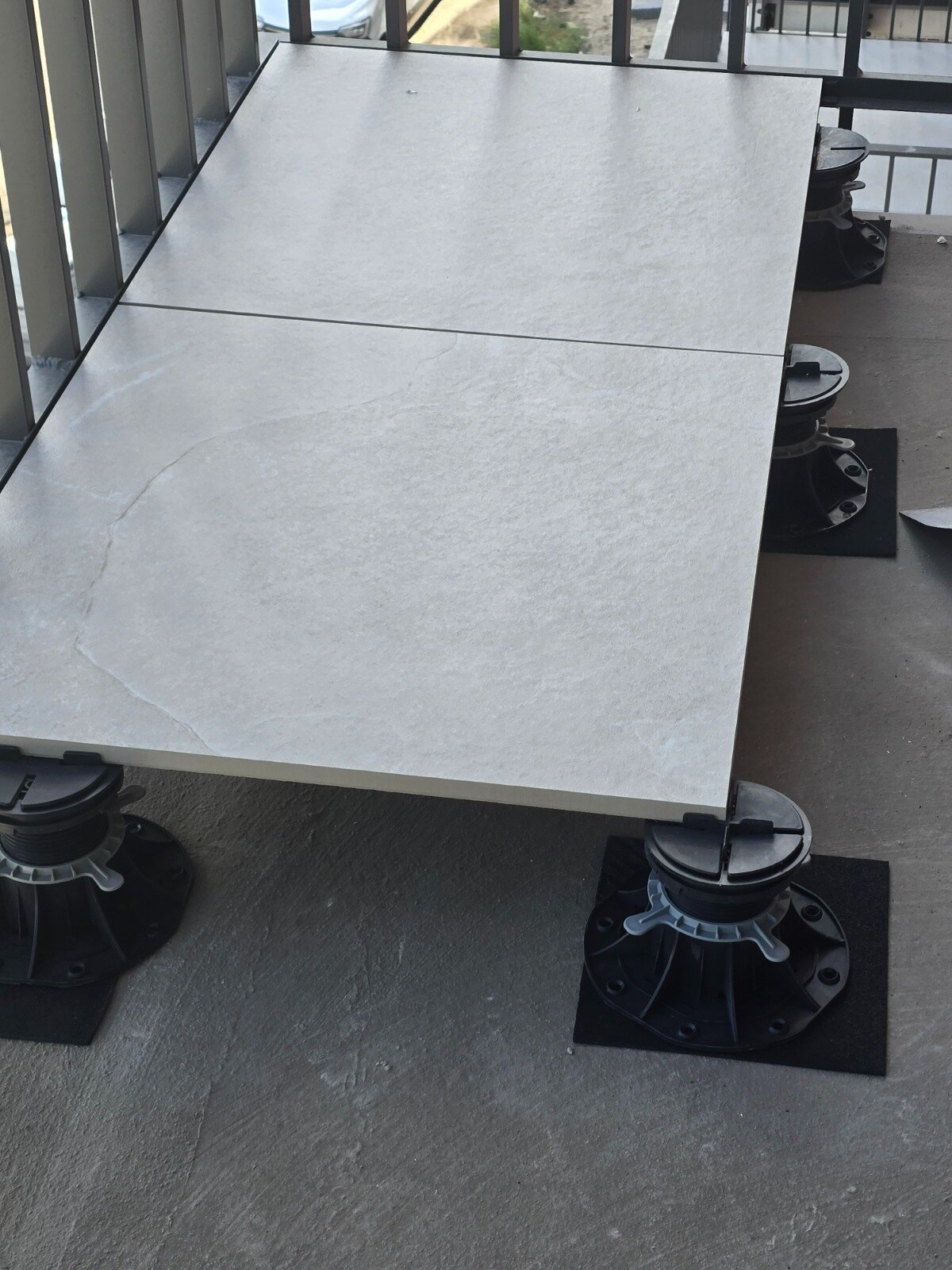 3 mm dilatation joints between porcelain tiles on a raised deck terrace on adjustable solver pedestals