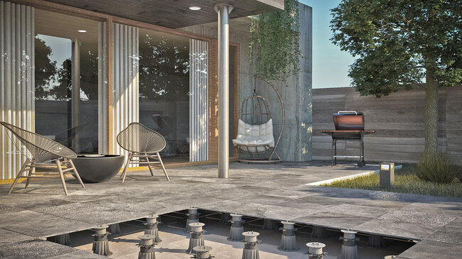 Terraza con suelo técnico de baldosas de piedra sobre soportes regulables.