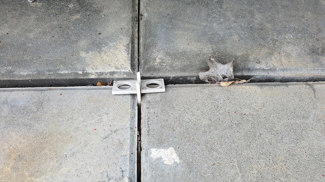 Plastic cross spacer for laying tiles on the terrace.