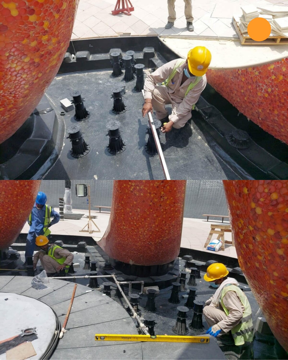 Trabajadores usando niveles de burbuja para alinear e instalar soportes regulables alrededor de la estructura de una fuente exterior.